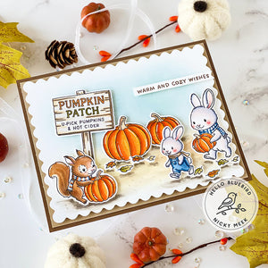 Autumn-themed card with pumpkins, bunnies, and a squirrel on a white background.